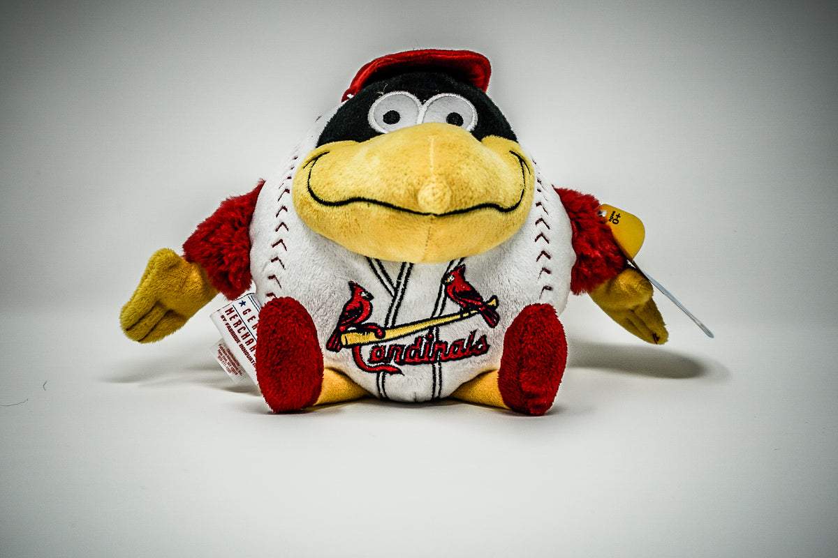 St. Louis Cardinals mascot Fredbird helps carry baggage from the